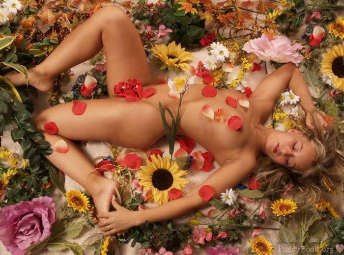 naked-beauty-covered-and-surrounded-by-flowers