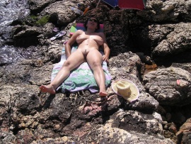 nudist-wife-relaxing-on-rocks