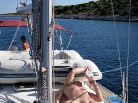 pretty-girl-nude-on-boat-reading